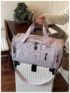 Waterproof durable travel duffel bag, purple shoulder bag, ideal for outdoor trips and storage.