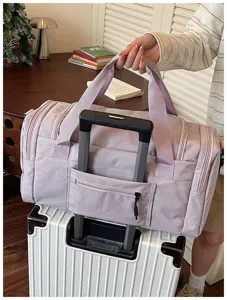 Light purple travel duffel bag with luggage sleeve, durable waterproof fabric for trip.
