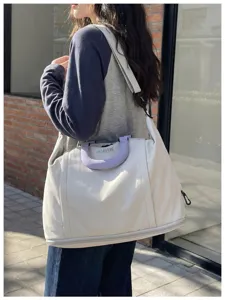 Large capacity travel duffel bag for women, weekend overnight bag with extended zipper design.