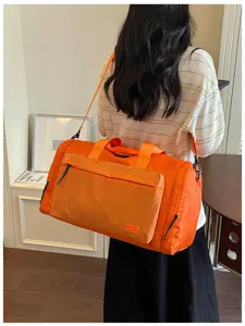 Large capacity waterproof travel duffel bag with wet dry separation for fitness and short trips.
