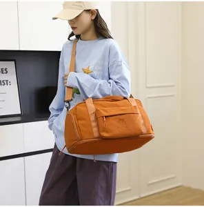 Waterproof travel duffel bag for men and women, large capacity shoulder luggage bag for outdoor use.