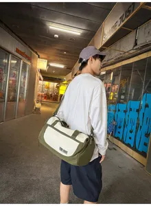 Travel duffel bag detail, green and white color block design, casual daily carry style