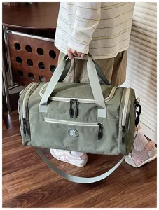Waterproof travel duffel bag with wet dry separation, durable shoulder weekender bag.