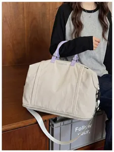 Large capacity travel bag for women, waterproof duffel bag, casual shoulder messenger bag.