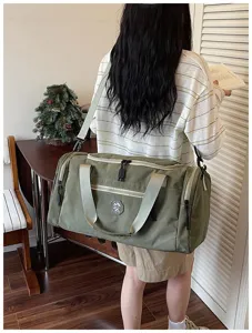 Waterproof travel duffel bag for gym, sports, and outdoor weekend trips. Spacious storage.