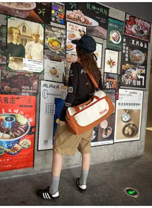 Large capacity travel duffel bag with stylish color block design, perfect for gym and trips.