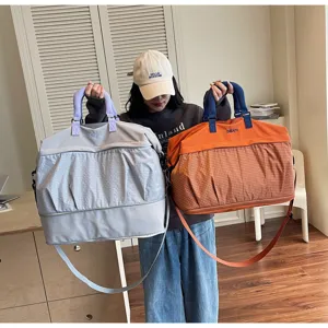 Large capacity expandable travel duffle bag, stylish fitness gym bag for short trips.