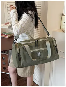 Green travel duffel bag with shoulder strap, large capacity waterproof gym bag for travel.