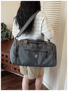 Grey waterproof travel duffel bag with dry wet separation, ideal for gym, sports and weekend trips.