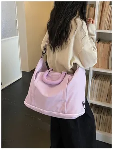 Light purple large capacity shoulder travel bag detail view, casual style, perfect for short trips.