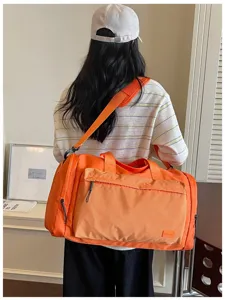 Orange large capacity travel duffel bag waterproof gym bag for outdoor sports and trips