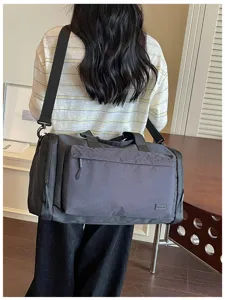 Large capacity waterproof travel duffel bag with dry wet separation for gym and sports use.