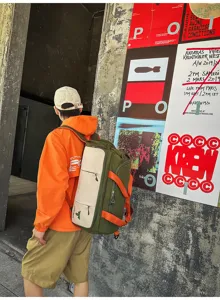 Detail view of the multi-purpose nylon travel backpack in green and beige with orange straps.