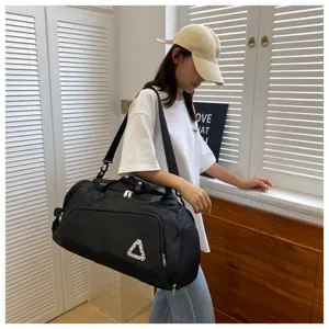 Black Oxford cloth travel duffel bag with shoulder strap for outdoor sports and gym use.