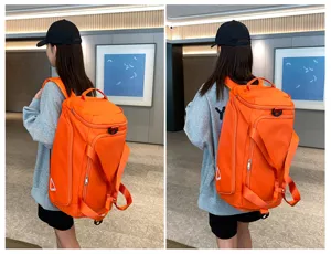 Detail view of a bright orange multi-functional travel backpack, ideal for daily use and trips.