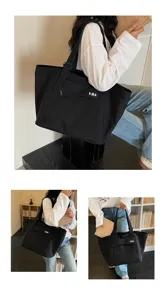 Black canvas tote bag casual commuting waterproof shoulder bag with mesh pocket and letters.