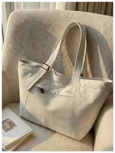 Canvas tote bag with mesh pocket, casual shoulder bag for commuting, travel, and daily use.