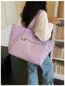 Large capacity purple canvas tote bag with mesh pocket, casual shoulder bag for commuting daily use.