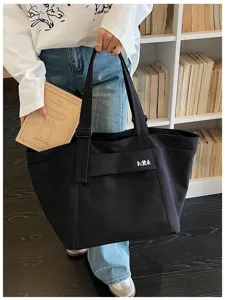 Black canvas tote bag with front mesh pocket large capacity casual commuter shoulder bag