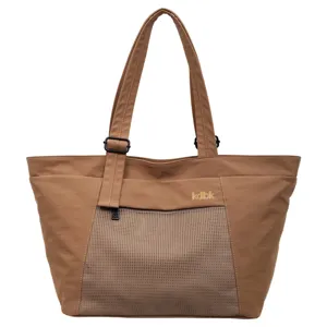 Brown casual tote bag with front mesh pocket, durable shoulder straps, versatile daily use.
