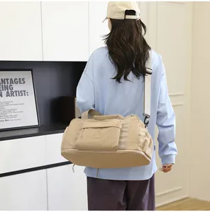 Waterproof travel duffel bag for women and men, large capacity shoulder bag for gym and trips.