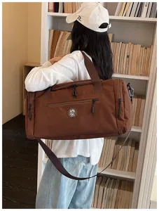 Large capacity brown travel duffel bag, waterproof shoulder luggage bag for students.