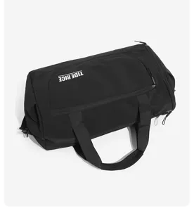 Black travel duffel bag with large capacity and durable handles for gym and daily trips.