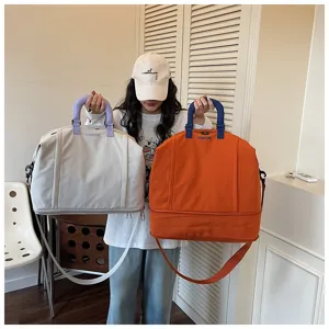 Large capacity travel duffel bag for women, versatile waterproof shoulder weekender bag.