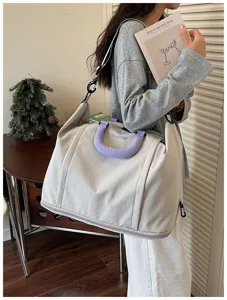 Large capacity women's travel bag, lightweight waterproof shoulder crossbody luggage bag.