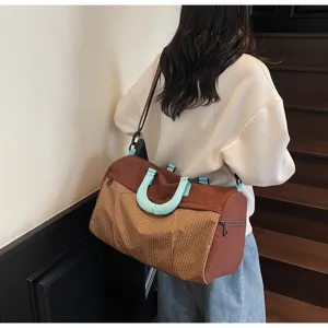 Large capacity travel duffle bag for women, stylish lightweight shoulder crossbody fitness bag.