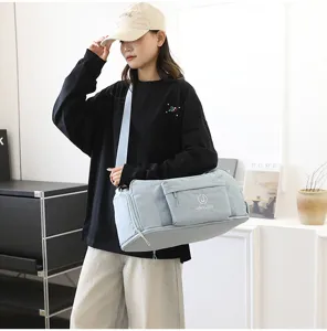 Waterproof travel duffel bag for men and women, large capacity shoulder luggage bag with stylish design.