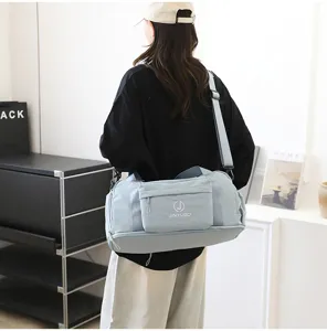 Waterproof travel bag for men and women, large capacity shoulder luggage bag with dry wet pockets.