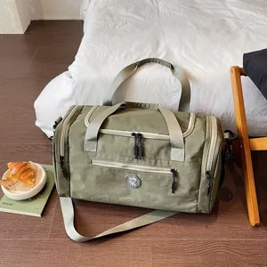 Waterproof travel duffel bag with shoe compartment, durable gym bag for weekend trips.