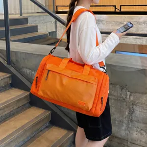 Orange large capacity travel duffel bag waterproof fitness gym bag for short trip storage
