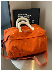 Expandable travel duffel bag with cute dots and bow print for fitness, swimming, and trips.