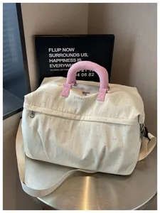 Expandable travel duffel bag with cute pink bow pattern, large capacity fitness and gym bag.