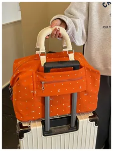 Expandable travel duffel bag with luggage sleeve, orange polka dot gym overnight bag.