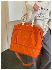 Expandable travel bag with dry wet separation, orange luggage bag for gym travel.
