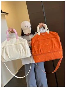 Expandable travel duffel bag with wet dry separation for fitness, gym, sports, and luggage storage.