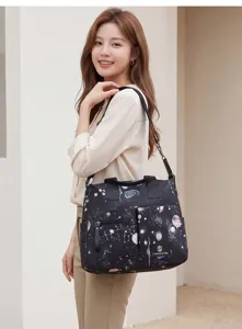 Sac à langer multifonctionnel avec motif étoilé, sac à bandoulière et fourre-tout maman.