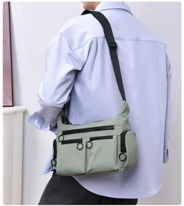 Multi-pocket commuter crossbody shoulder bag, casual utility style with smooth zipper design.