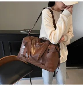 Waterproof large capacity travel duffel bag for men and women, stylish fitness sports backpack.