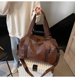 Large capacity brown leather travel duffel bag for men and women gym weekend overnight bag.