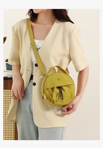 Sac bandoulière rond jaune vue détaillée, sac à main casual tendance avec joli cordon de serrage.