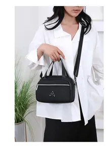 Sac bandoulière décontracté en nylon pour femme, sac à main noir multi-poches élégant.