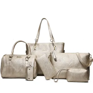 Gold floral embossed 6-piece handbag set, stylish tote, shoulder bag, and wallet combo.