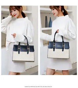 Detailansicht der stilvollen Handtasche mit Prägung, praktischen Henkeln und elegantem Design.