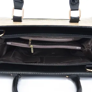 Stilvolle Damenhandtasche mit mehreren Reißverschlussfächern und Griffen für den Alltag.