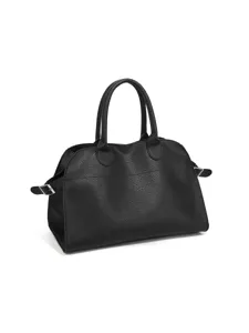 Black tote bag detail view, featuring premium leather texture and durable handles for daily commute.
