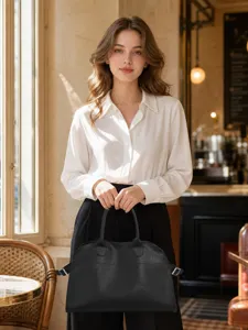 Elegant black leather handbag detail view, casual tote bag for women daily commuting style.